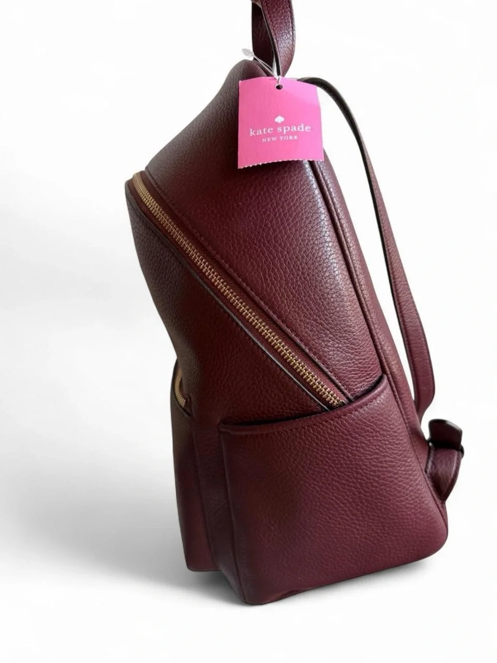 kate spade Pebbled Leather Backpack in Burgundy